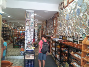 Caleb pretending to be interested in the ceramics store.